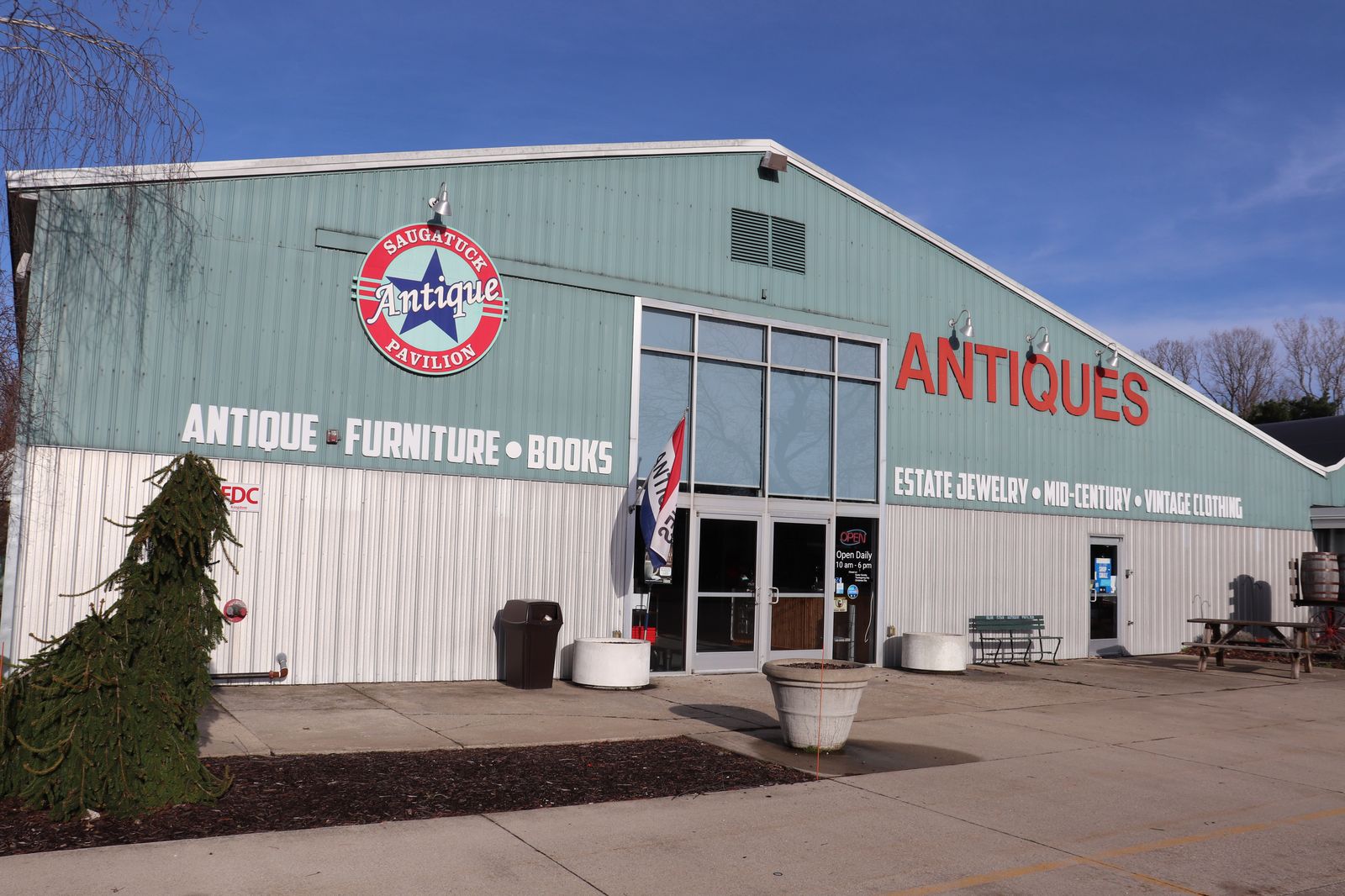 The ANTIQUES sign on the exterior of Saugatuck Antique Pavilion in Douglas, Michigan, our editor's pick