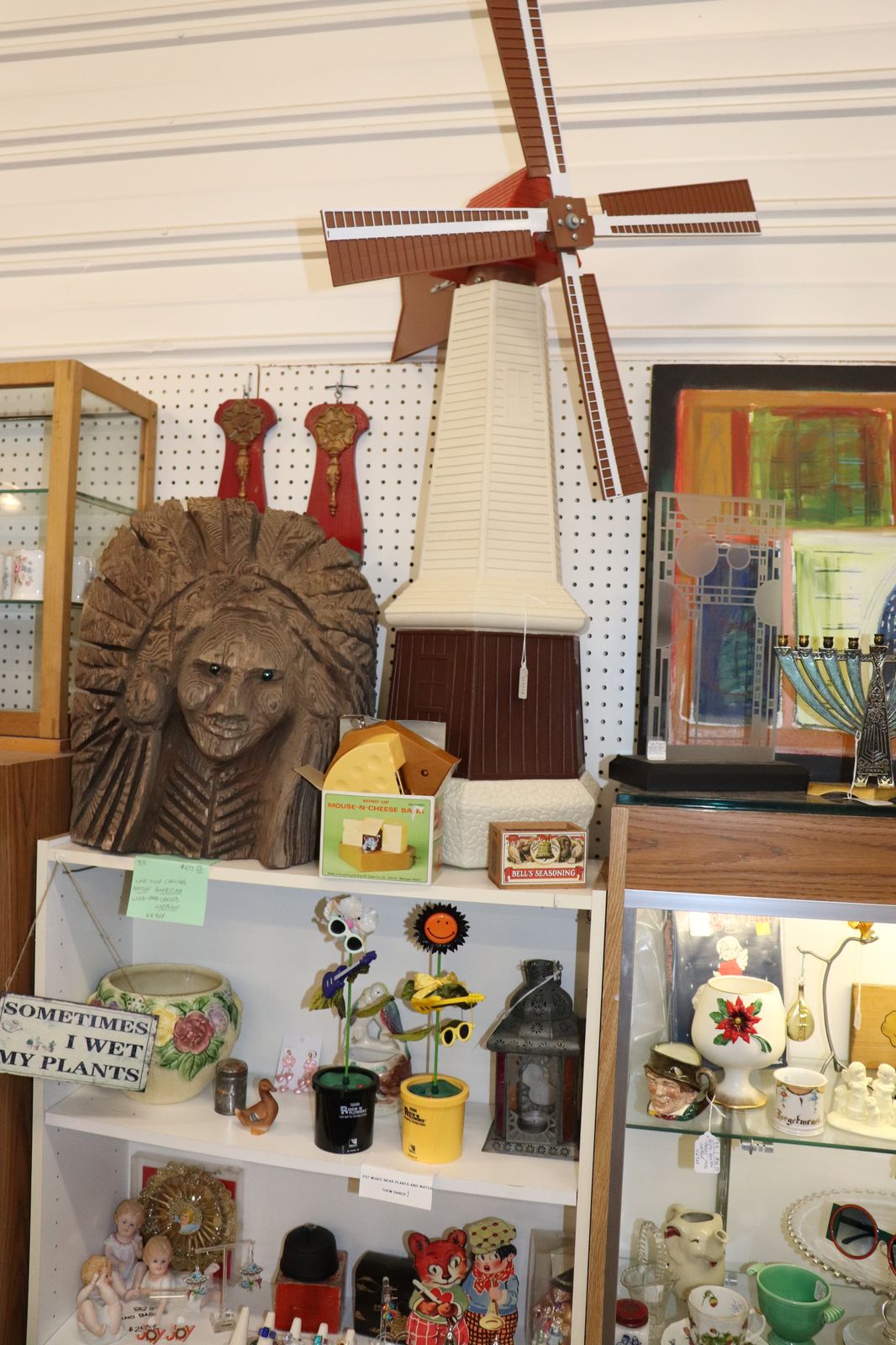 Restored vintage Cities Service gas pump and Michigan license plate collection at Saugatuck Antique Pavilion